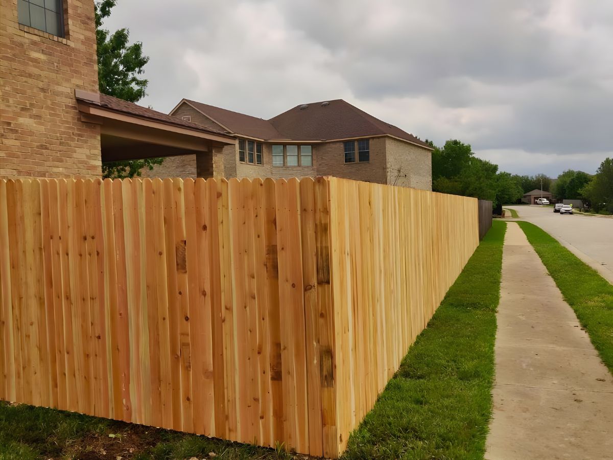 Sturdy cedar wood fence designed to create a private and visually appealing boundary