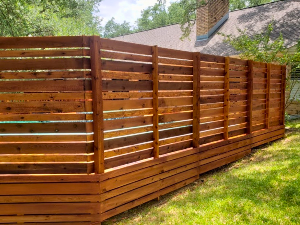 Wood panel fence with vertical boards creating a clean, uniform look