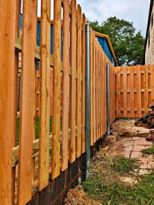 spaced wooden picket fence for front yard curb appeal